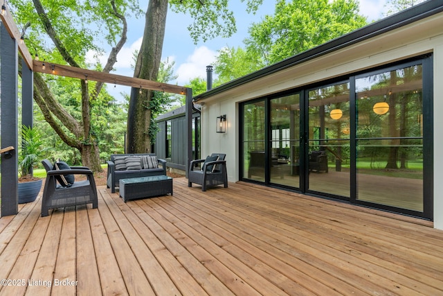 wooden terrace featuring outdoor lounge area