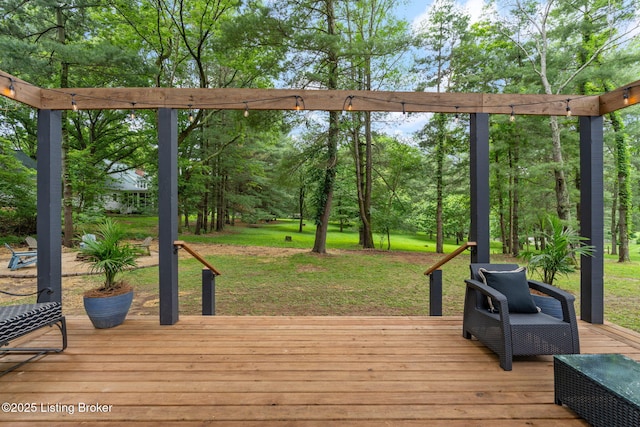 wooden terrace with a lawn