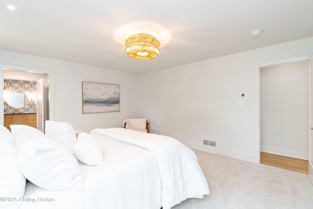 bedroom featuring light carpet