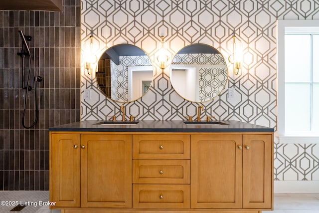 bathroom with walk in shower and vanity