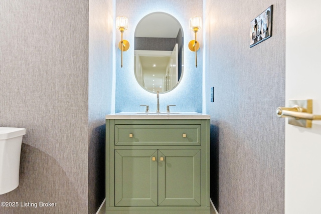 bathroom with vanity and toilet