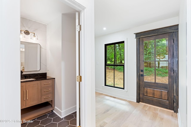 bathroom featuring vanity and wood-type flooring