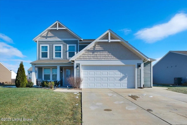 view of front of home featuring a garage, central AC unit, and a front lawn