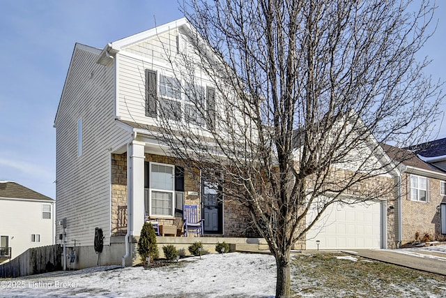 front of property featuring a garage and a porch