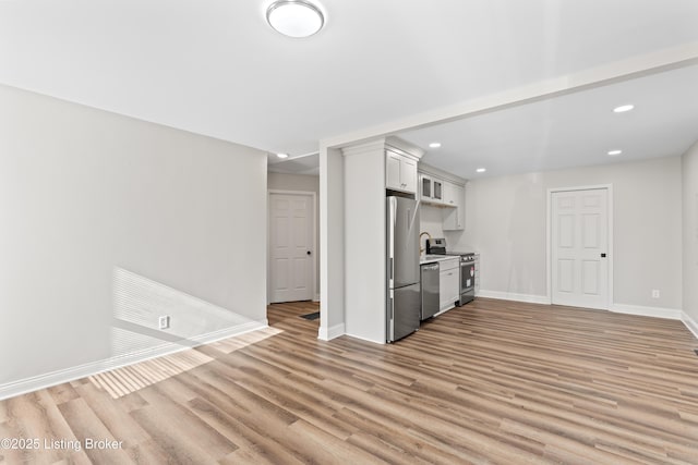 unfurnished living room with light wood-type flooring