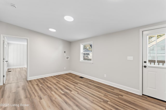 spare room featuring light hardwood / wood-style flooring