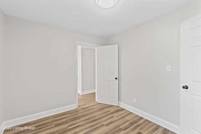 spare room featuring light hardwood / wood-style floors