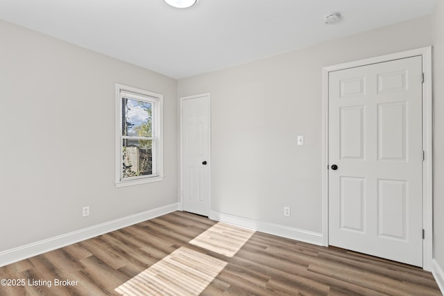 empty room with wood-type flooring