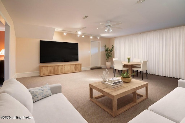 living room with ceiling fan and carpet flooring