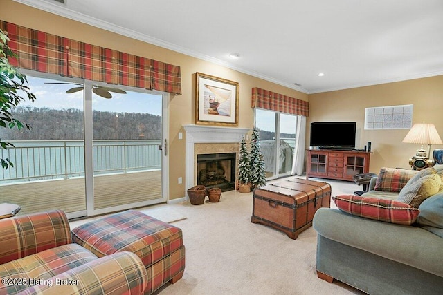 carpeted living room featuring crown molding and plenty of natural light