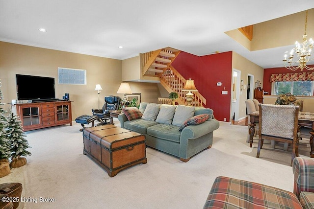 carpeted living room featuring an inviting chandelier and crown molding