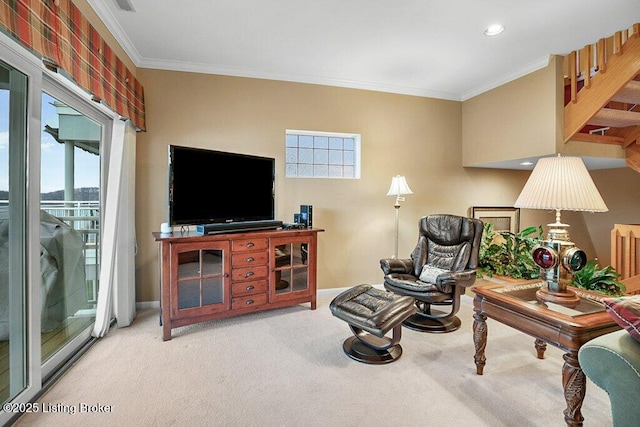 carpeted living room with ornamental molding