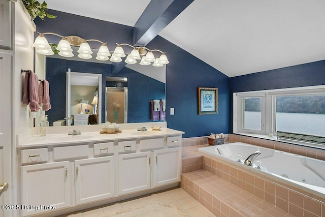 bathroom featuring vanity, tile patterned flooring, lofted ceiling with beams, and tiled bath