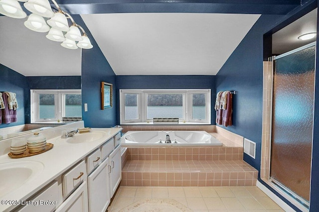 bathroom featuring tile patterned flooring, vanity, separate shower and tub, and lofted ceiling