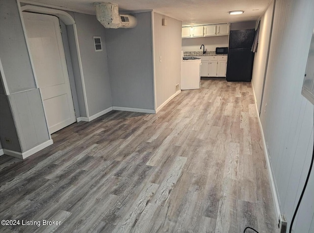 interior space with sink and light hardwood / wood-style floors