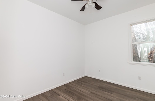 empty room with dark wood-type flooring and ceiling fan