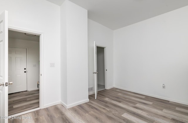 unfurnished bedroom featuring light wood-type flooring