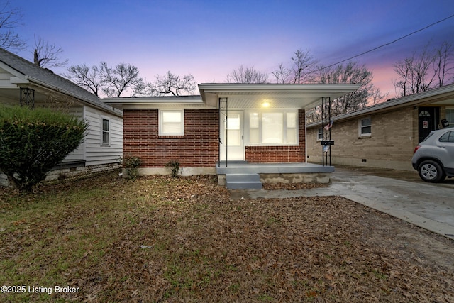 view of front of home featuring a carport