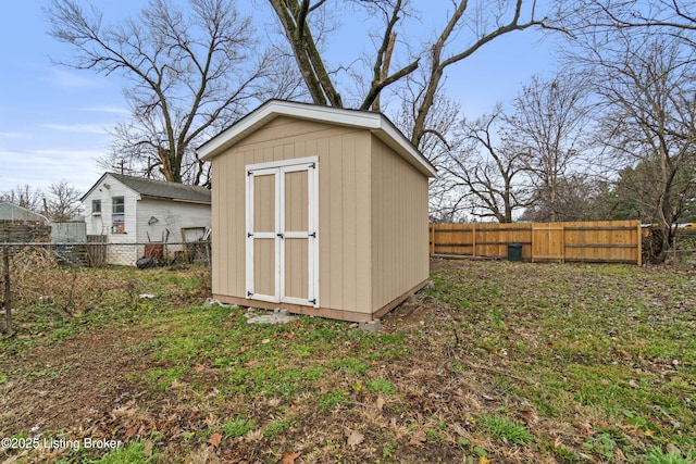 view of outbuilding with a yard