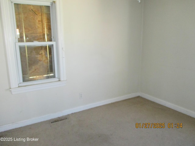 view of carpeted spare room