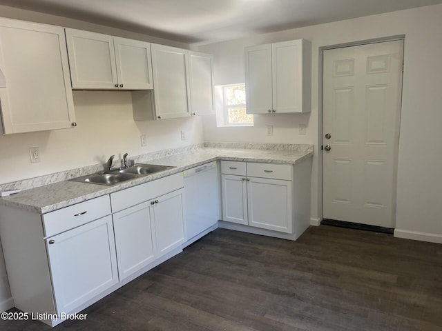 kitchen with white cabinetry, dark hardwood / wood-style floors, white dishwasher, and sink