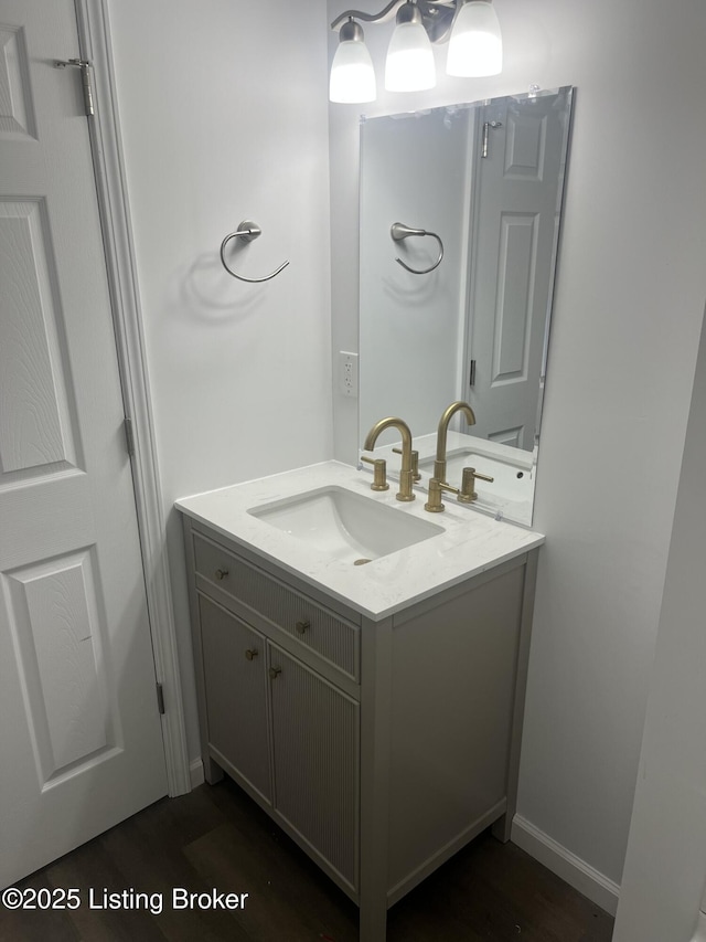 bathroom with vanity and hardwood / wood-style flooring