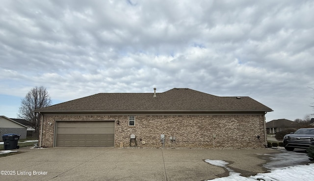 view of side of home featuring a garage