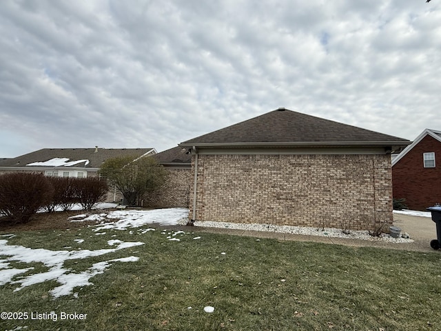 view of home's exterior with a yard