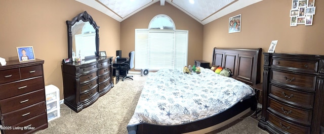 carpeted bedroom featuring vaulted ceiling with skylight