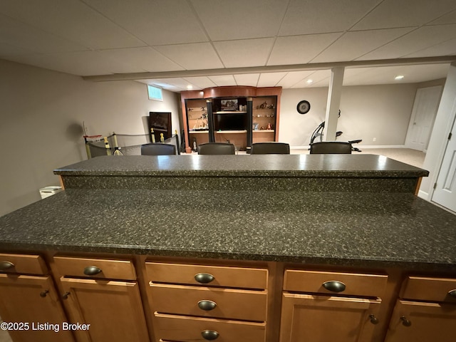 bar featuring dark stone countertops