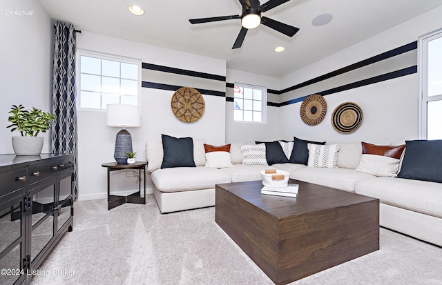 living room with light carpet and ceiling fan