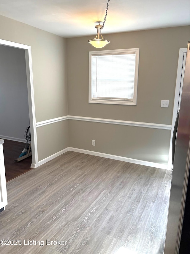 empty room with wood-type flooring