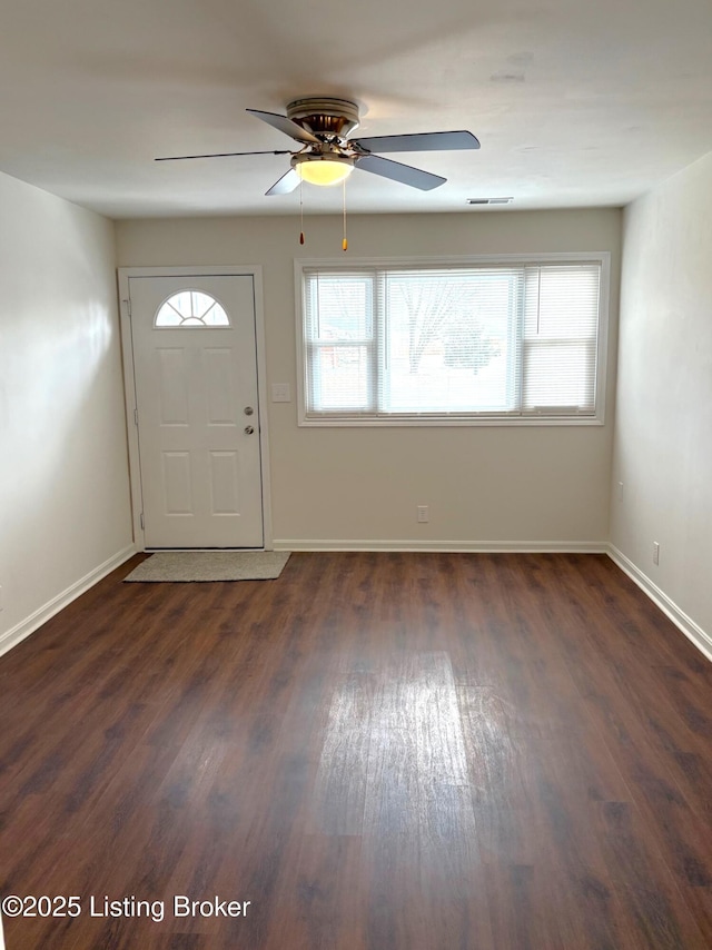 entryway with ceiling fan and dark hardwood / wood-style flooring