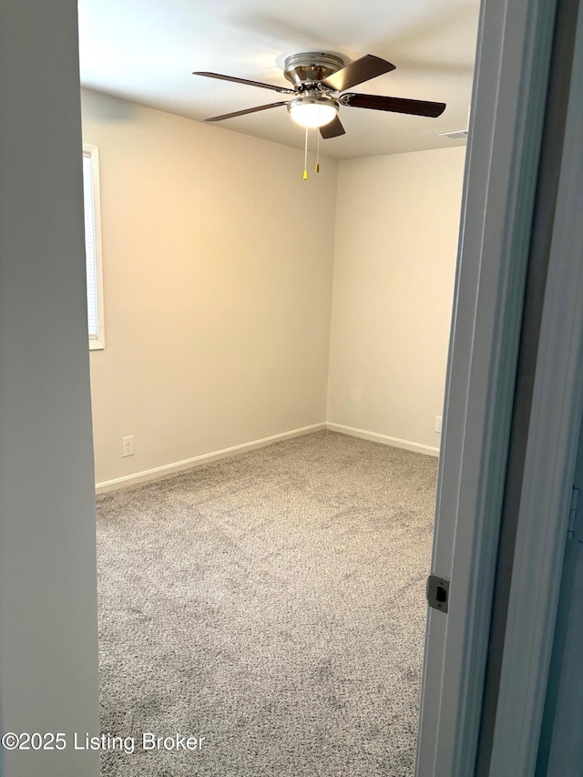 carpeted empty room with ceiling fan