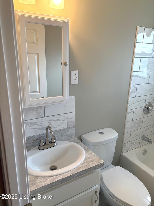 full bathroom with vanity, toilet, shower / bathing tub combination, and backsplash