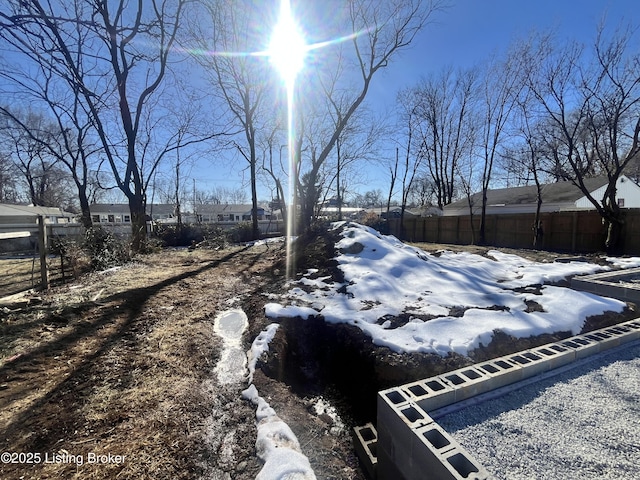 view of yard layered in snow