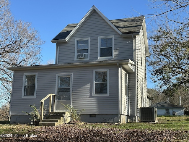 view of front facade featuring cooling unit and central AC unit