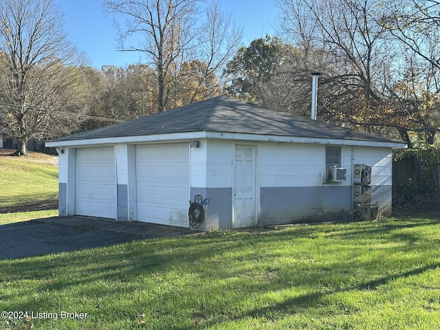 garage with a lawn