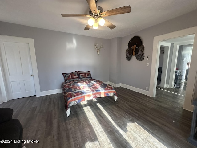 bedroom featuring dark wood-type flooring and ceiling fan