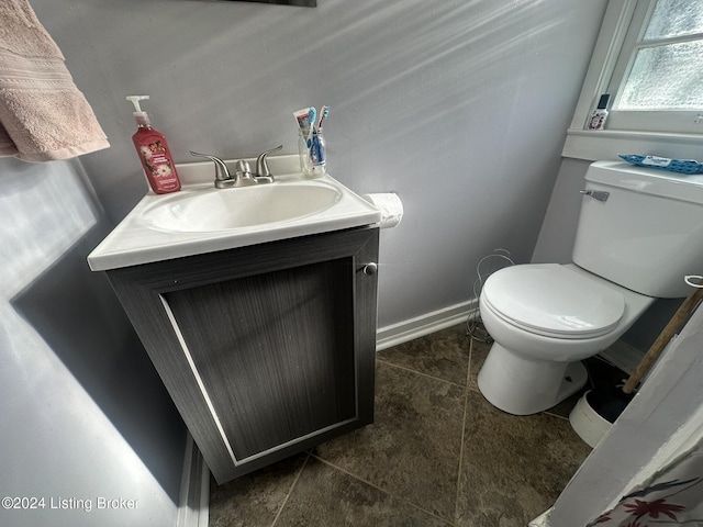 bathroom with vanity and toilet