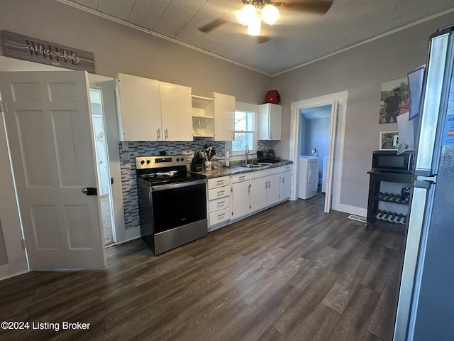 kitchen featuring appliances with stainless steel finishes, white cabinetry, sink, decorative backsplash, and ornamental molding