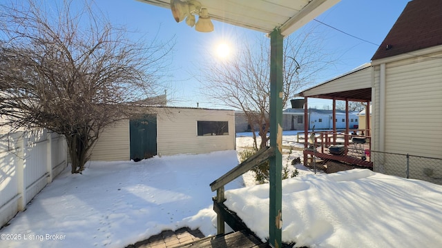 view of yard layered in snow