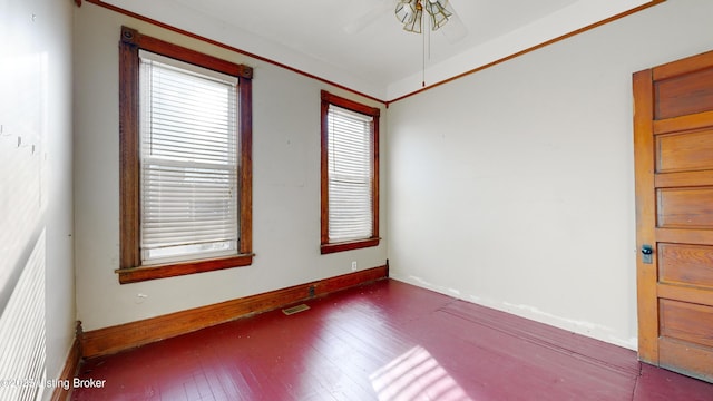 unfurnished room with dark hardwood / wood-style flooring