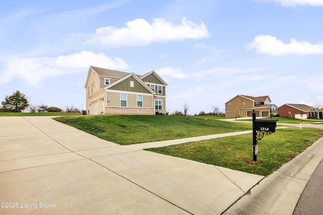 view of front of property with a garage and a front yard