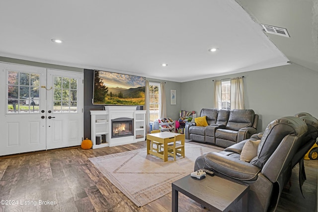 living room with hardwood / wood-style floors and french doors