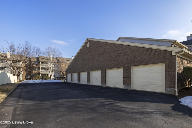 view of side of property with a garage