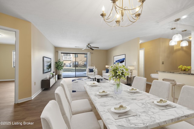 dining area with dark hardwood / wood-style floors and ceiling fan