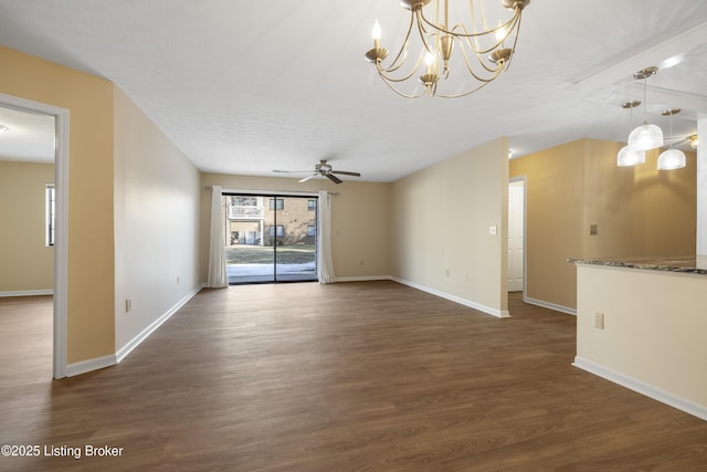 unfurnished living room with dark hardwood / wood-style flooring and ceiling fan