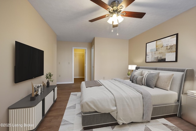 bedroom featuring hardwood / wood-style flooring and ceiling fan