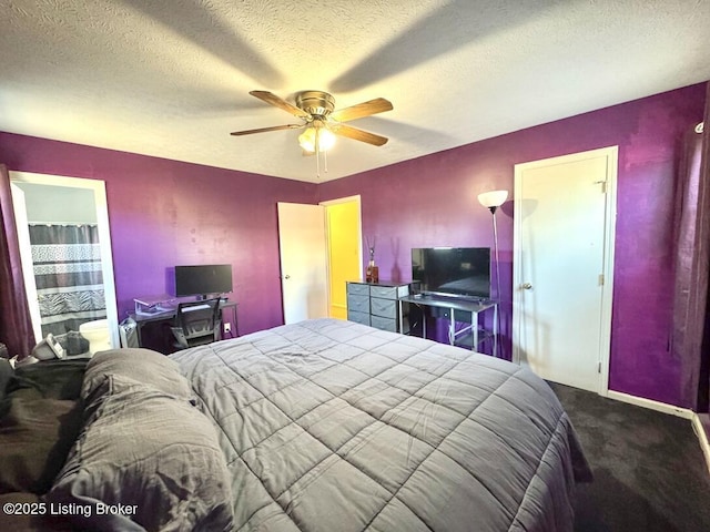 bedroom with ceiling fan, carpet flooring, and a textured ceiling